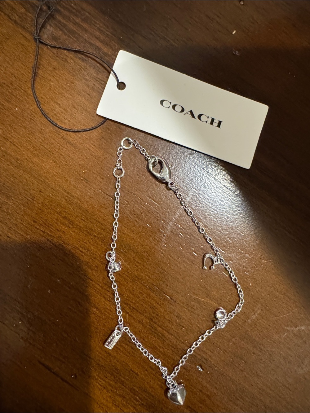 COACH Silver Heart Charm Bracelet with Signature Charms